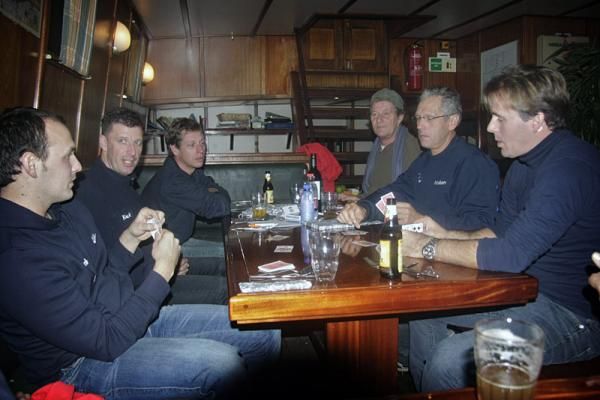 Rabobank team members pass the time with a game of cards.