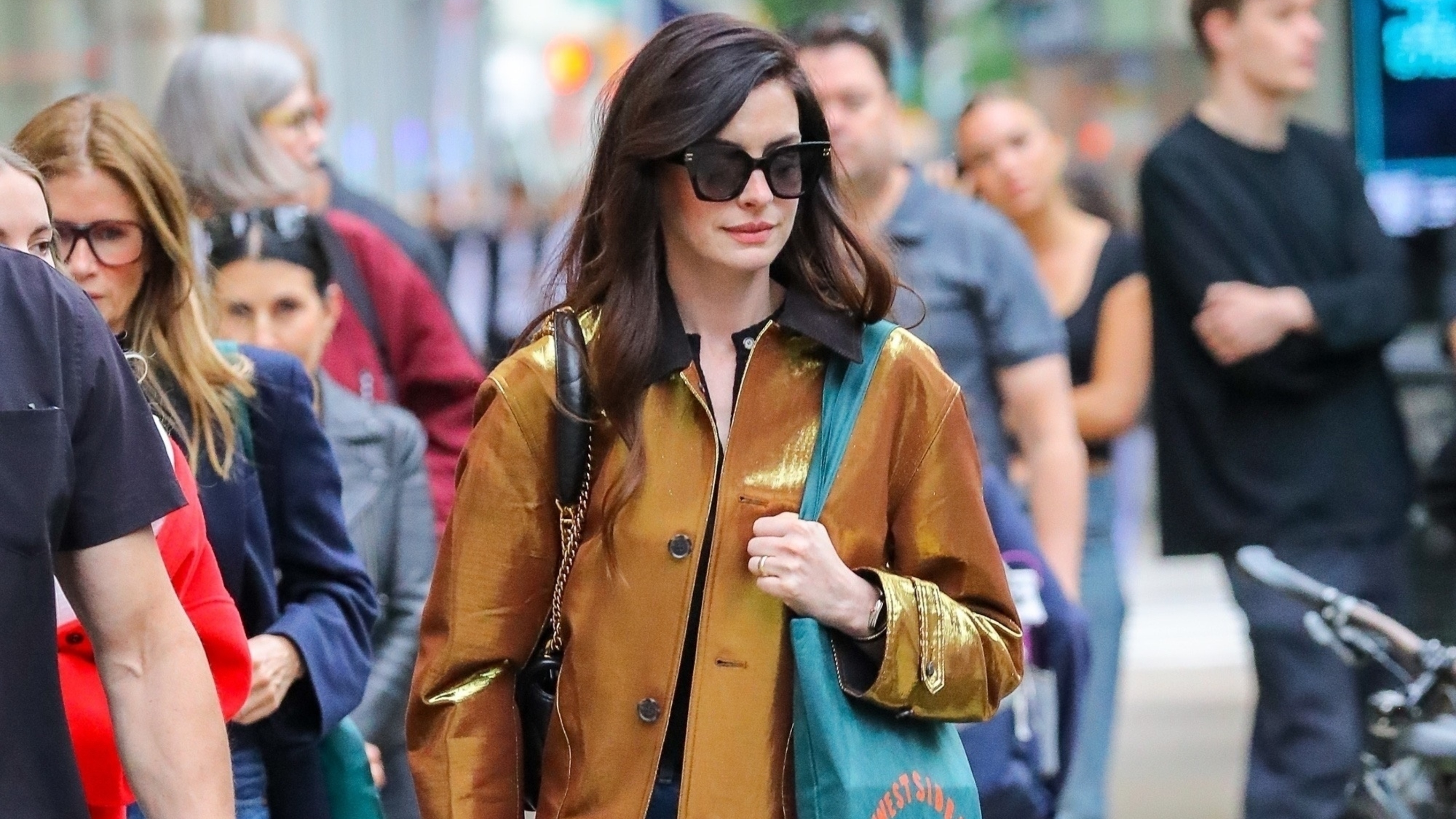 Anne Hathaway wearing a barn jacket in nyc
