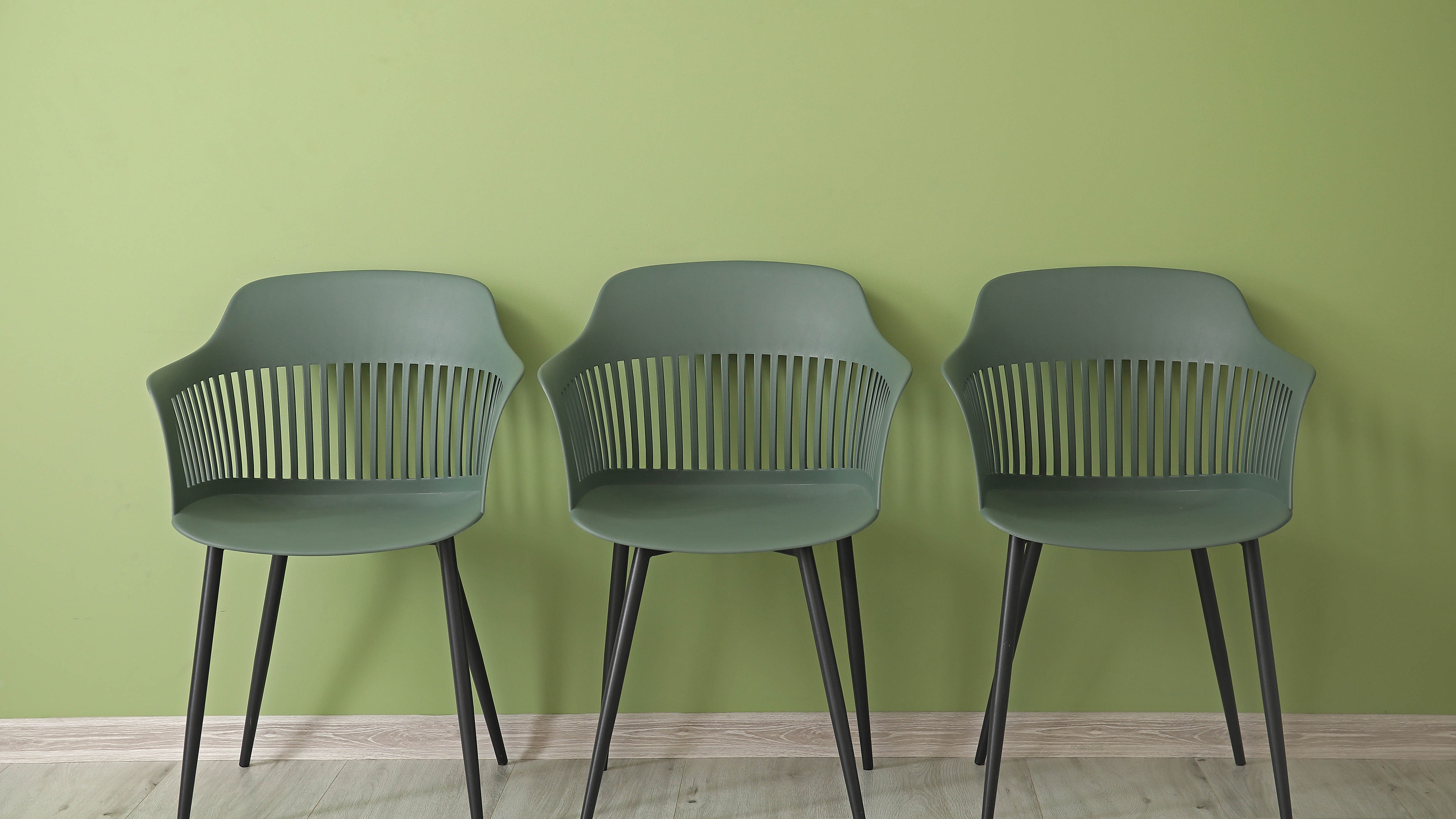 Green wall and chairs
