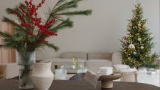 Close-up of a festive open plan living room and dining room with Christmas decorations
