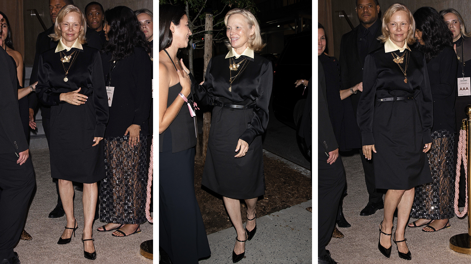 Pamela Anderson wearing a black outfit and gold medallions