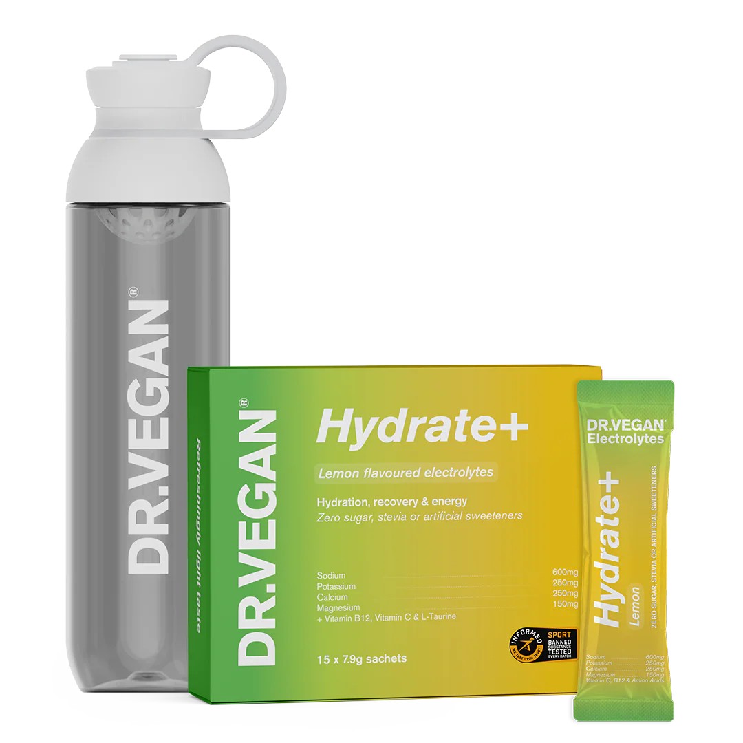 Water bottle with box and sachet of electrolytes next to it on white background