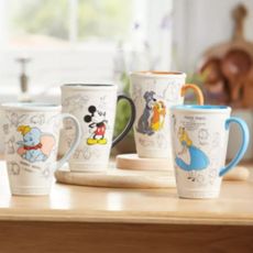 Four character mugs on kitchen counter 