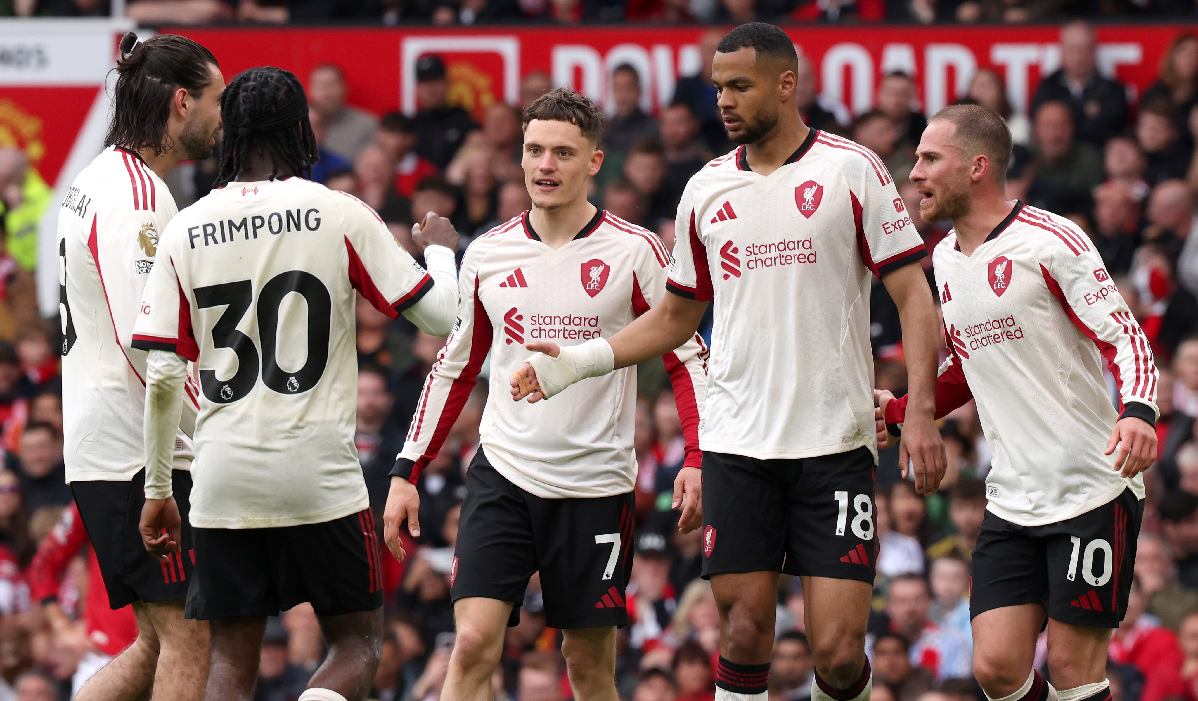 Cody Gakpo of Liverpool celebrates scoring his team's second goal with teammates during the Premier League match between Manchester United and Liverpool at Old Trafford