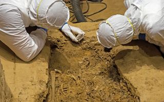 Archaeologists examine the burial, which could contain the body of Sir George Yeardley.