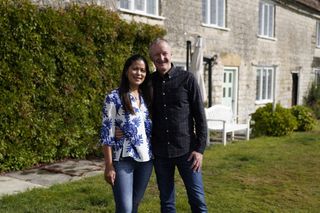 Lynn and Dave stand outside their new farmhouse in the West Country