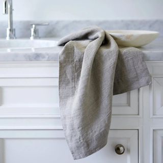Orkney Linen Bath Towel draped over the sink.