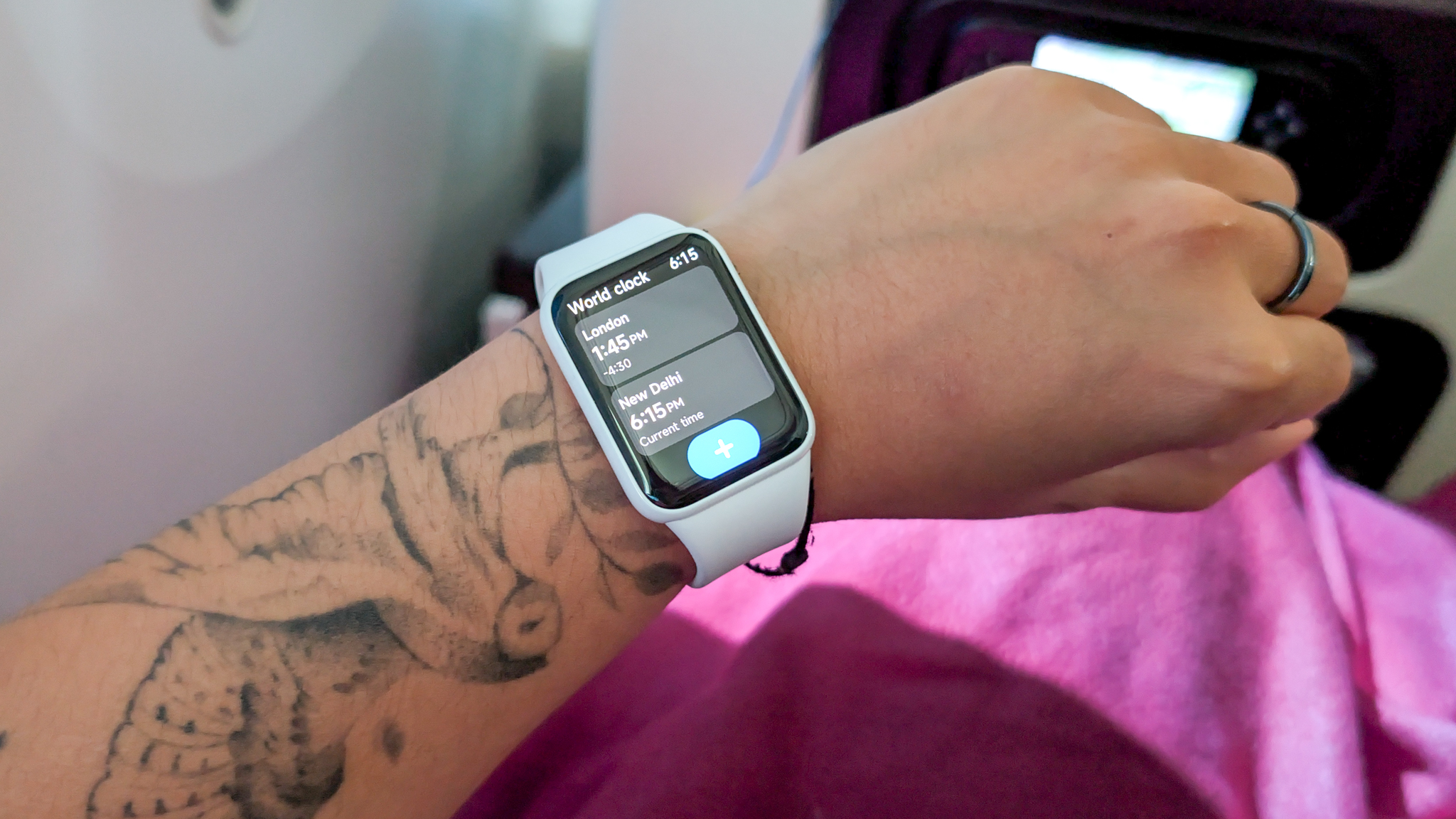 A person wearing a Xiaomi Smart Band 10 Pro smartwatch