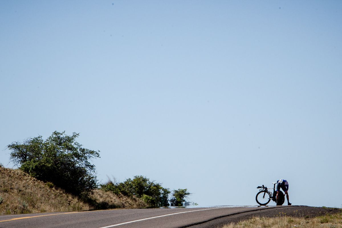 A rider stops to fix a dropped chain.