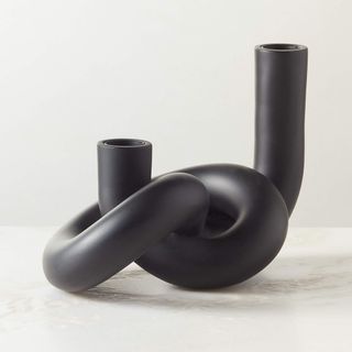 CB2 Asha Modern Black Knotted Double Taper Candle Holder against a white background.