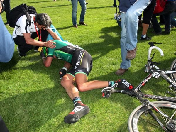Europcar's Damien Gaudin collapses on the infield after the finish of Paris-Roubaix.
