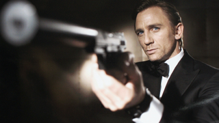 Daniel Craig looking butch, with large gun
