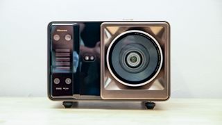 A Hisense XR10 Projector on a table