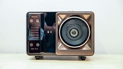 A Hisense XR10 Projector on a table