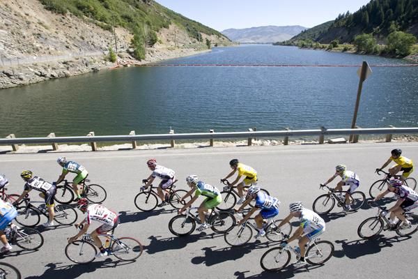 The peloton passes a lake early in the day's stage.