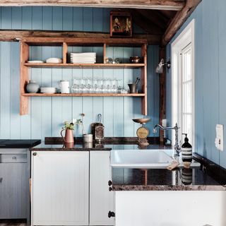 blue kitchen with rustic shelving, blue painted tongue and groove, white cabinets, dark grey worktop, Belfast sink