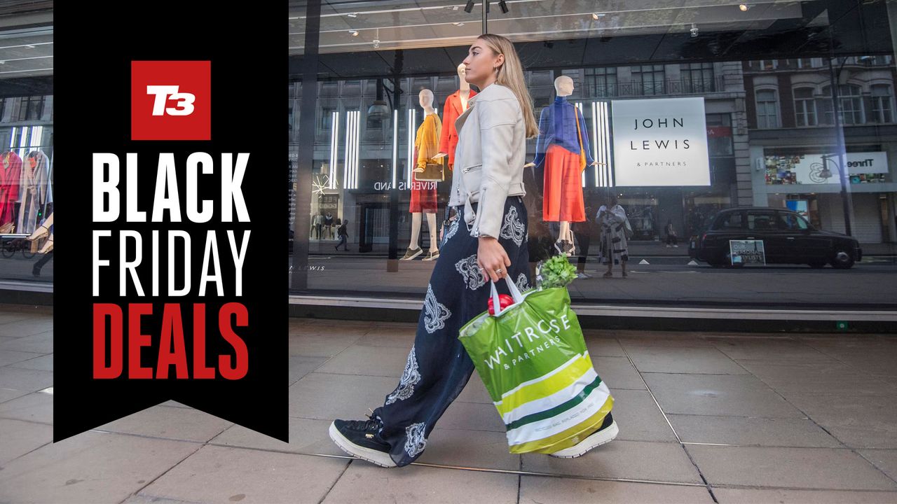 Best John Lewis Black Friday offers: young woman walking in front of a John Lewis store with a Waitrose bag