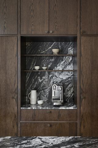 coffee niche in a modern wood kitchen with marble surround