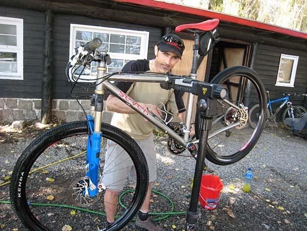 Mike cleans another bike.