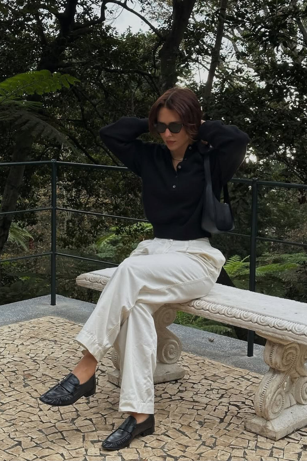 @deborabrosa wears black loafers, white trousers, black jumper