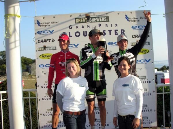 Tim Johnson gets to enjoy a beer with some friends on the podium.