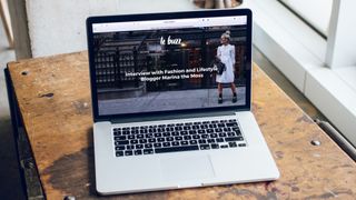 laptop open on website on table