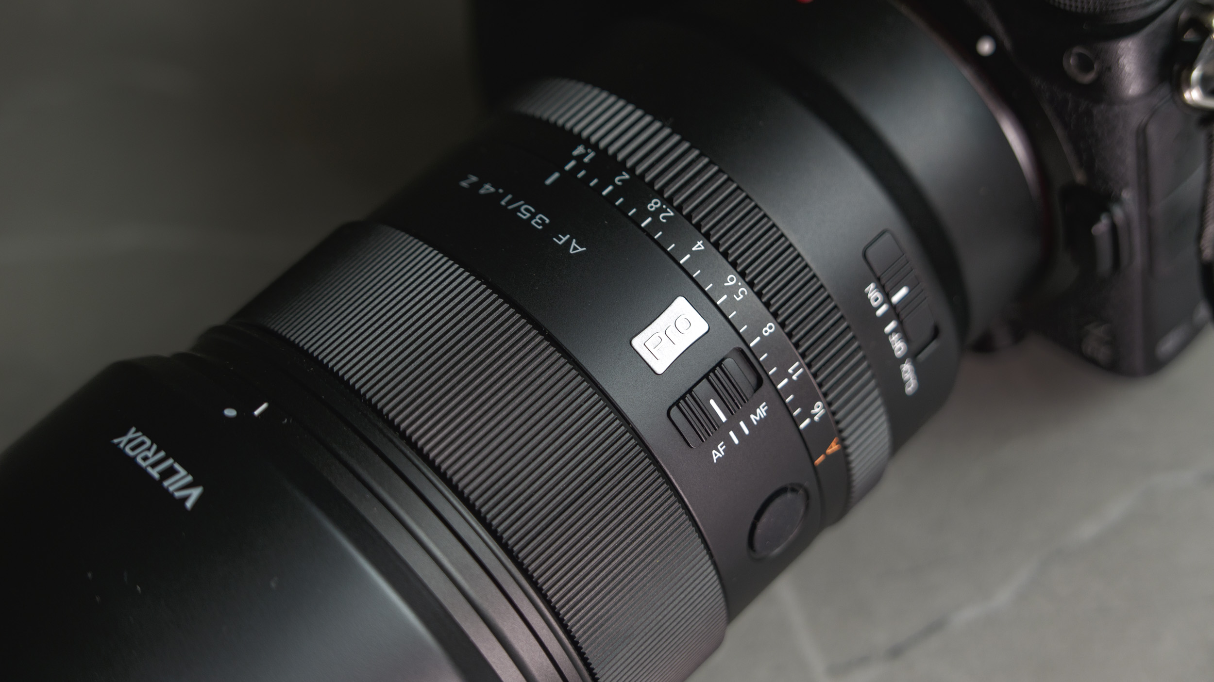 Viltrox AF 35mm F1.4 Pro lens attached to a Nikon mirrorless camera, closeup of the controls