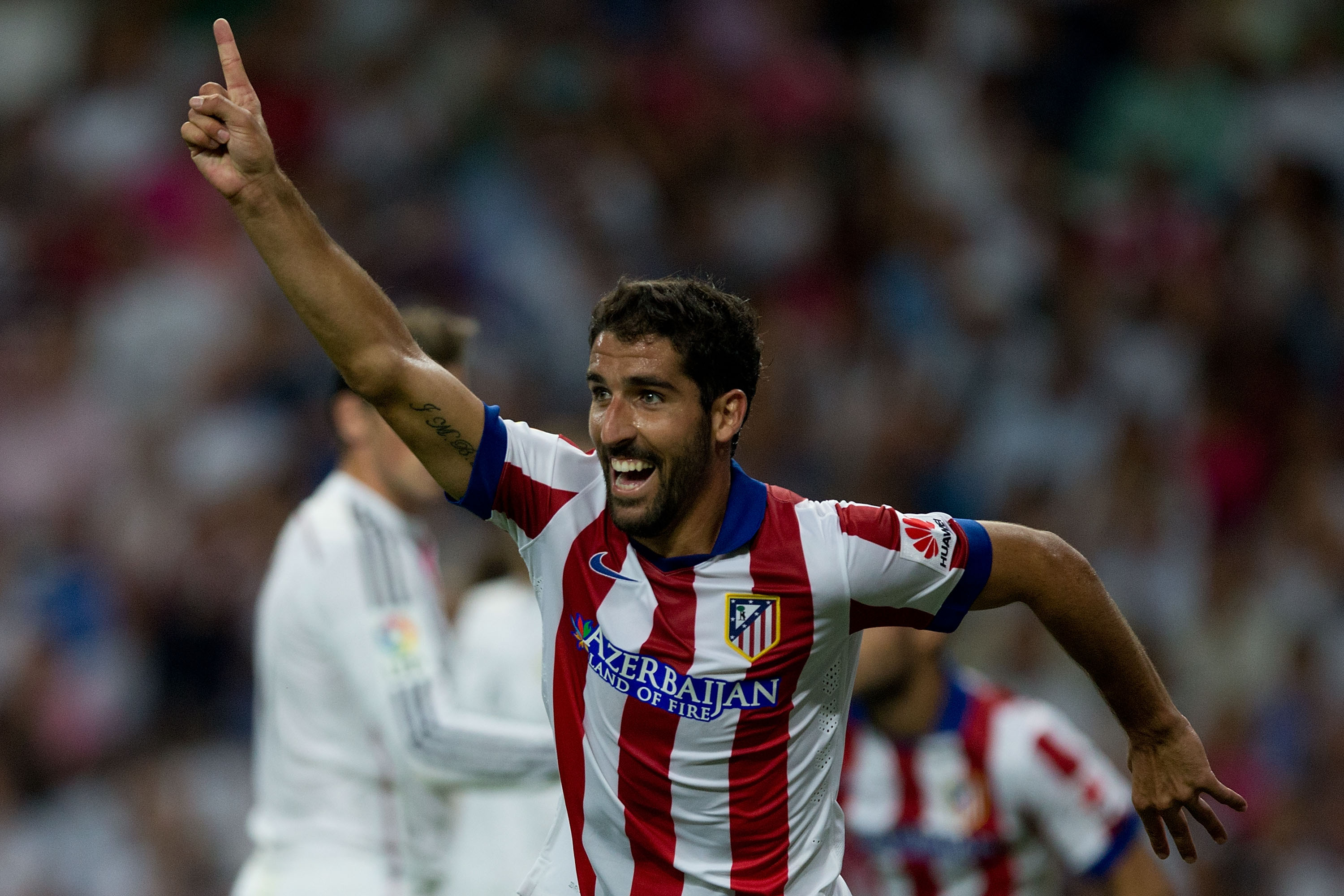 Raul Garcia celebrates after scoring for Atletico Madrid against Real Madrid in the Supercopa de España in August 2014.