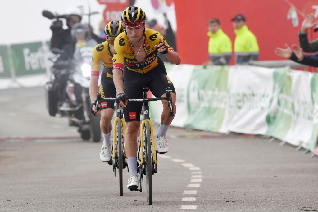 Team Jumbo's Slovenian rider Primoz Roglic gestures as he arrives to cross the finish line in first place followed by Team Jumbo-Visma's Danish rider Jonas Vingegaard during the stage 17 of the 2023 La Vuelta cycling tour of Spain, a 124,4 km race between Ribadesella and Alto de l'Angliru on September 13, 2023. (Photo by MIGUEL RIOPA / AFP) (Photo by MIGUEL RIOPA/AFP via Getty Images)