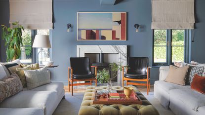 Blue living room with fireplace and abstract artwork
