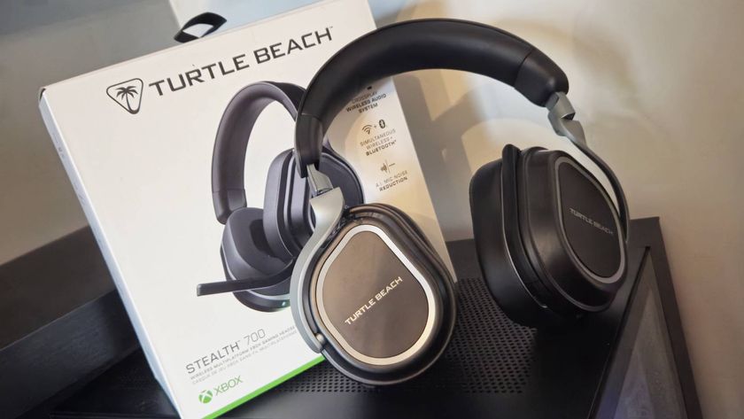 Photo taken by writer Rosalie Newcombe of the Turtle Beach Stealth 700 Gen 3 gaming headset sitting on top of a black PC tower with its box behind it.