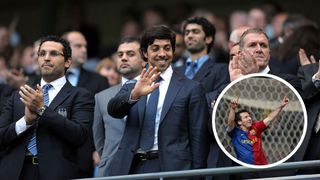 Sheikh Mansour waves to the Manchester City crowd as Lionel Messi celebrates while scoring for Barcelona