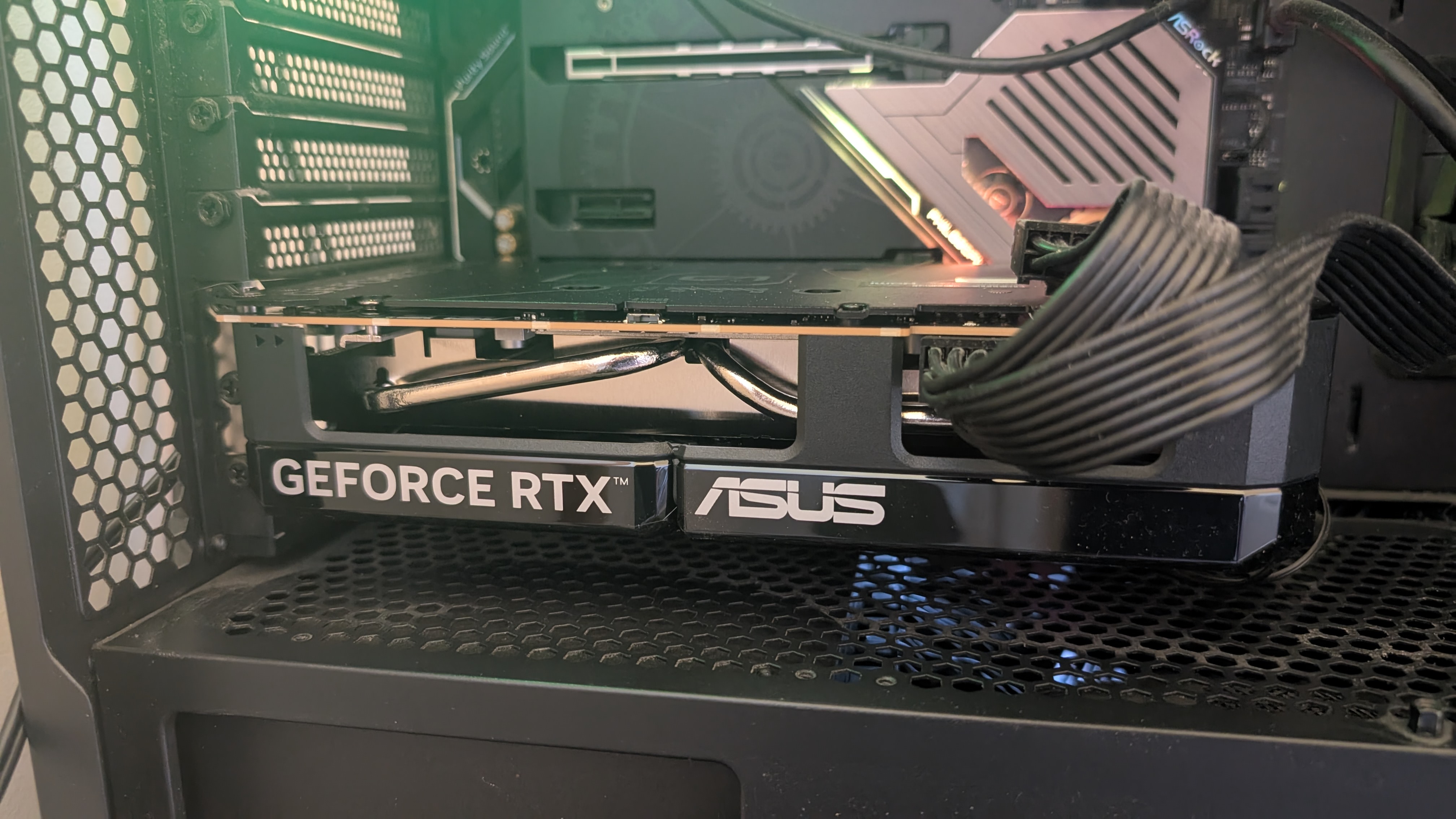 The Asus Dual OC RTX 5060 inside a PC case.