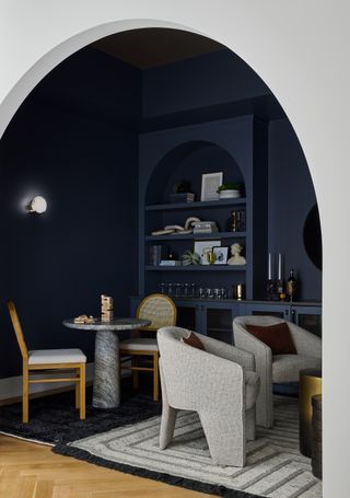 dark blue living room in Benjamin Moore Ashland Slate by Devon Grace Interiors