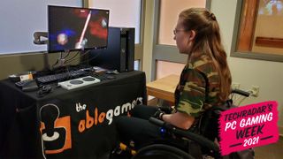 A Gamer With Disabilities Plays A Video Game With Help From The AbleGamers Charity