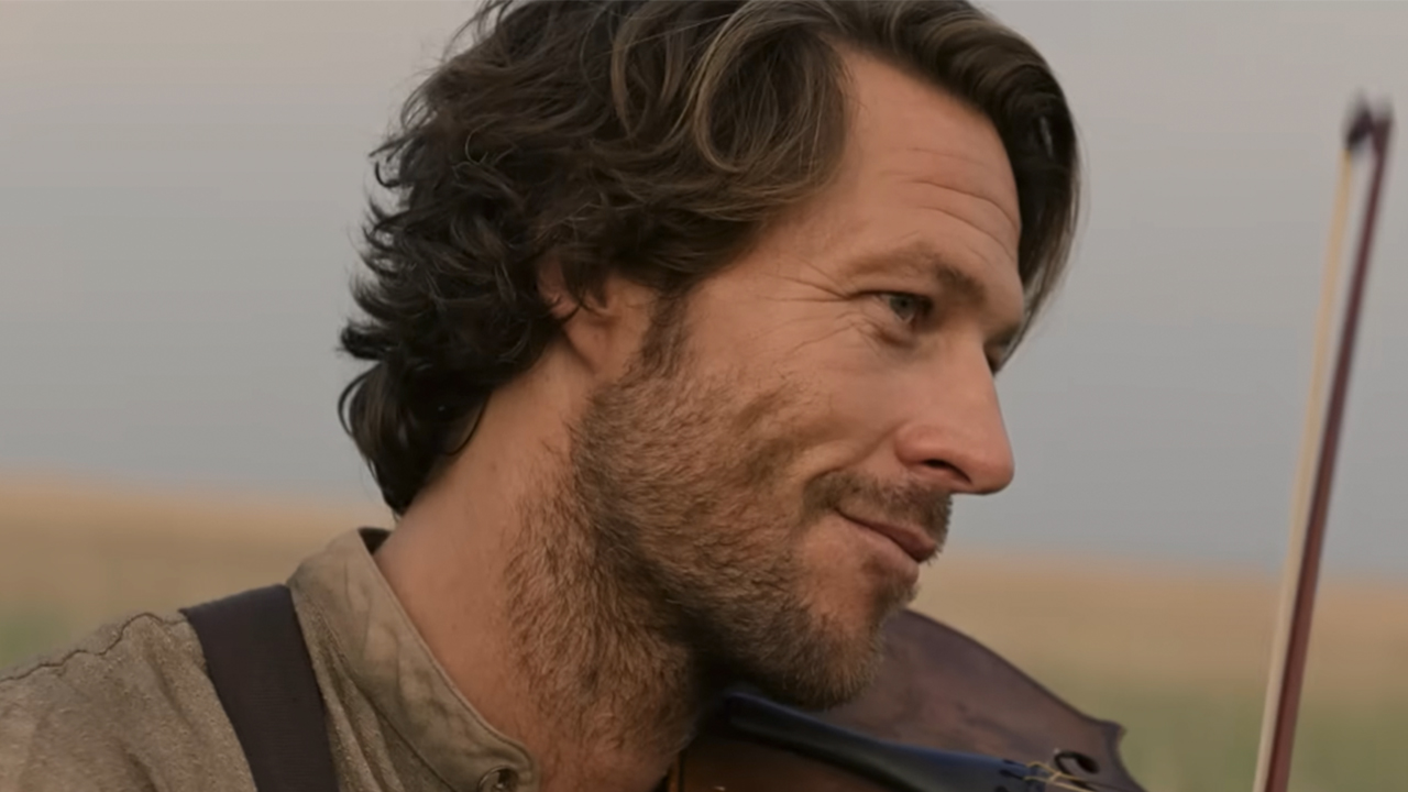 A close up of Luke Bracey smiling in Little House on the Prairie.