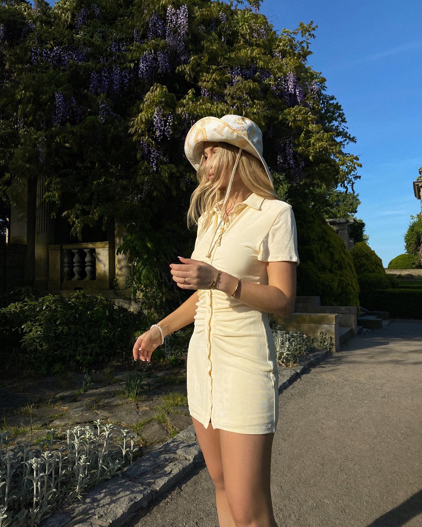 Michelle Rose Drumm wearing sun hat and mini dress