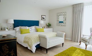 bright-bedroom-with-blue-headboard