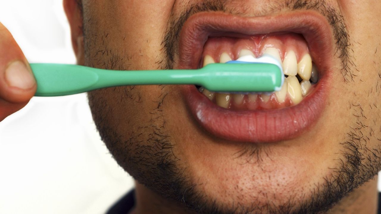 A man brushing his teeth