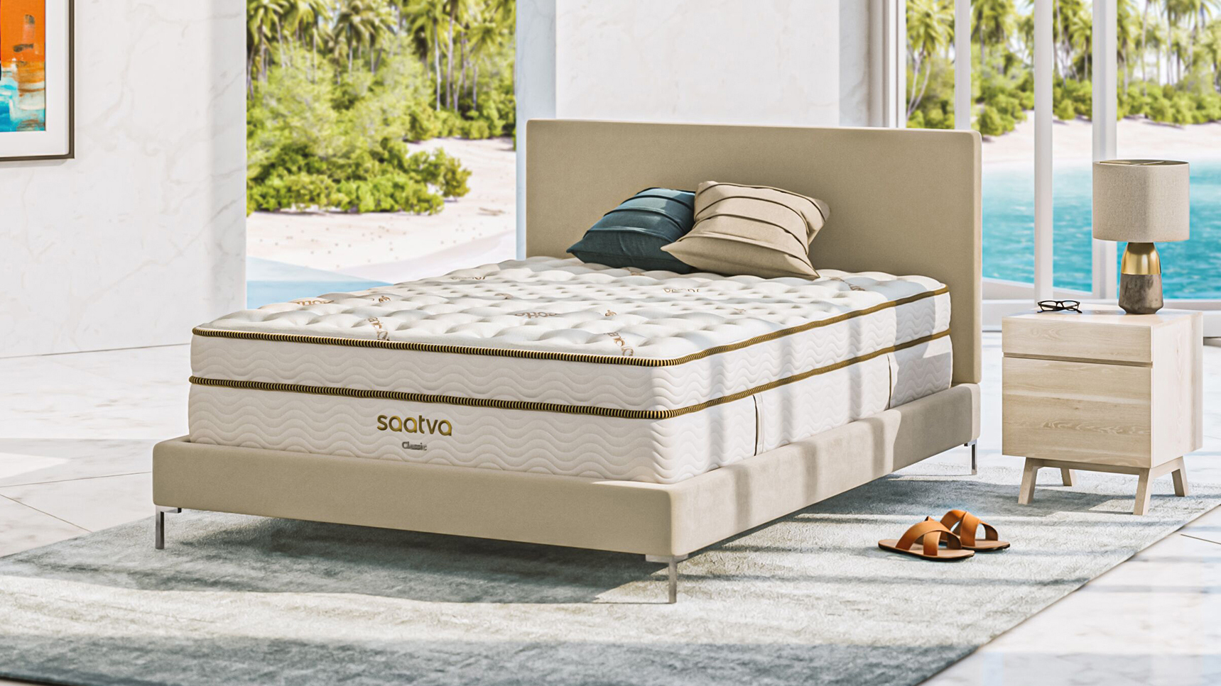 Photo shows the Saatva Classic innerspring hybrid on a luxury bed base placed in a summer home overlooking a blue pool