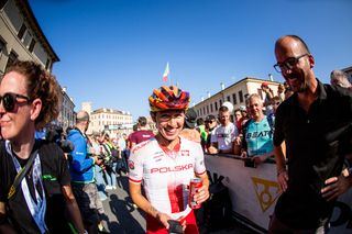 A happy Kasia Niewiadoma (Poland) heads to the podium after winning the world title