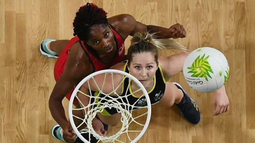 Two women playing netball