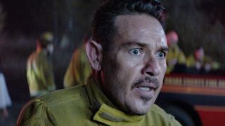 Kevin Alejandro as Manny looking concerned on Fire Country.