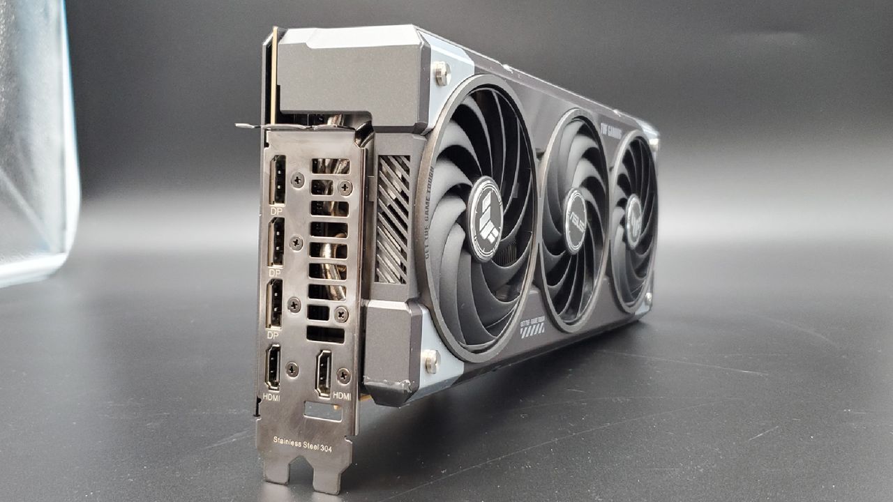 The exhaust side of the Asus TUF Gaming RTX 5070 Ti OC Edition on a silver background