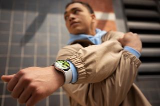 Samsung Galaxy Watch 6 on a man's wrist under a jacket