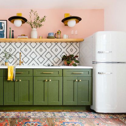Kitchen with green cabinet and open shelve 
