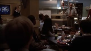 Richard Schiff addresses a crowd in the White House mess hall on The West Wing