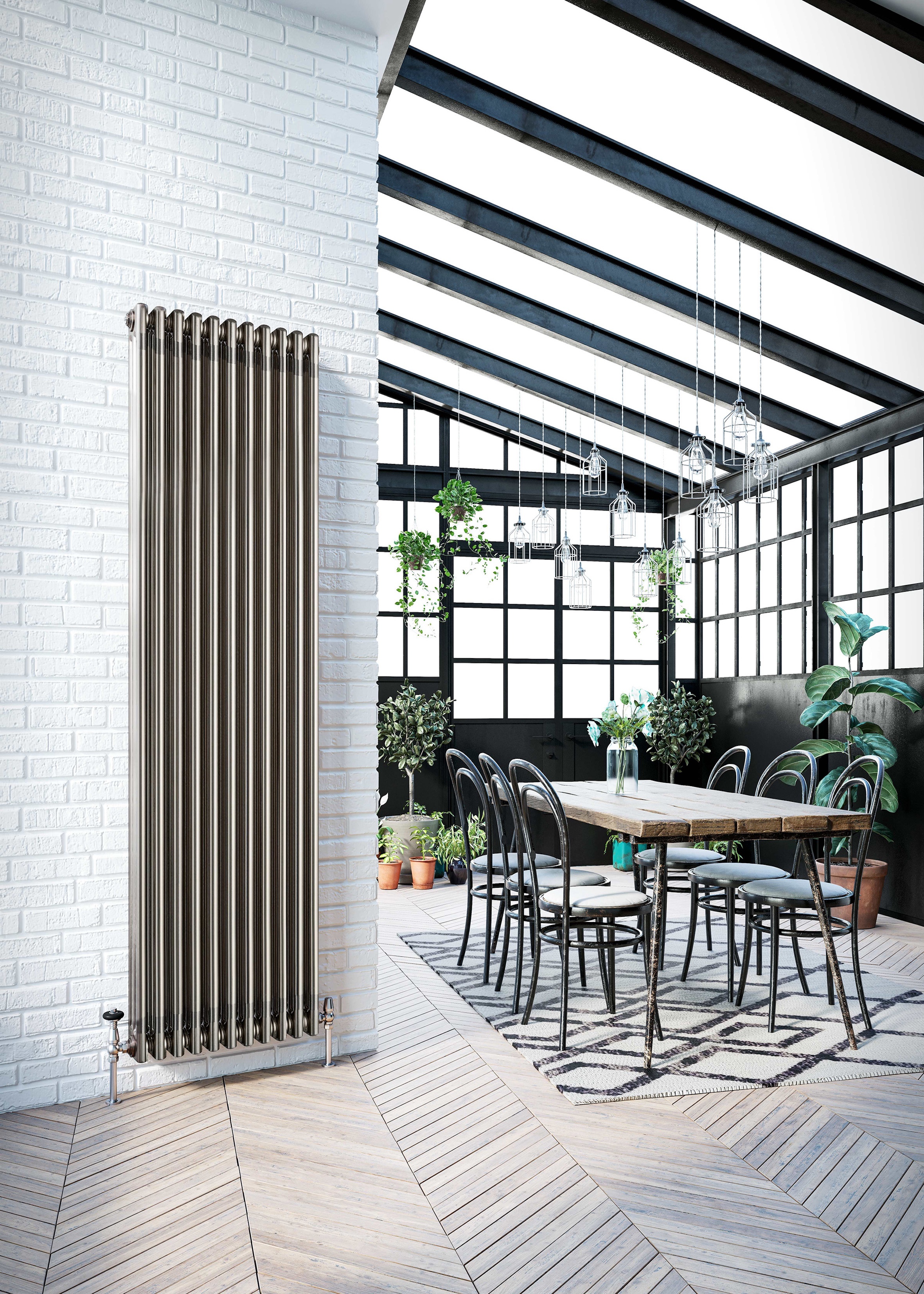 Glass conservatory extension with herringbone floor and black painted timber frame