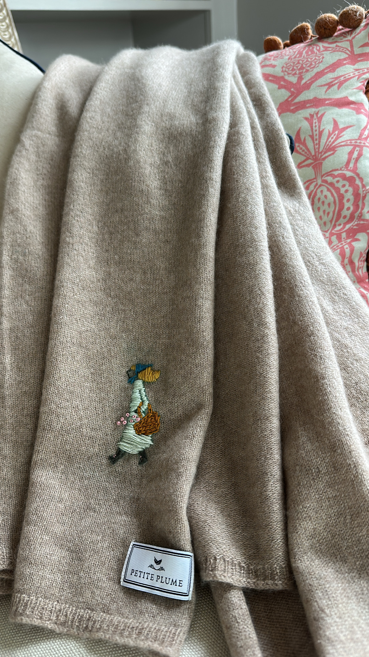 Larissa Mills' tan embroidered scarf