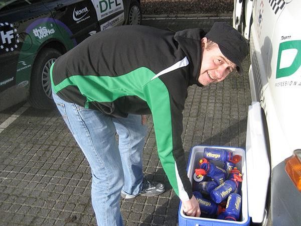 Soigneur Raul gathers all the empty bottles